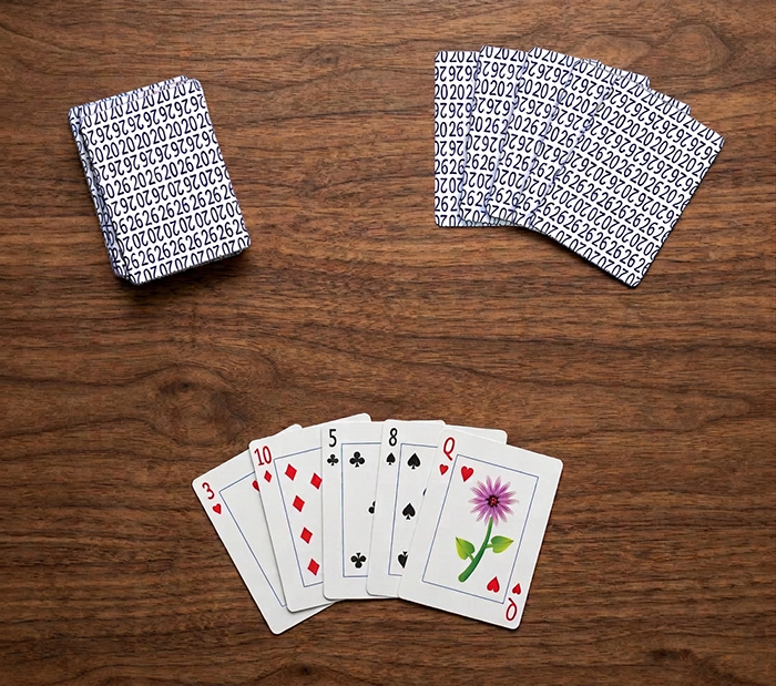 Playing cards spread on table